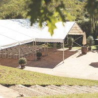 12m x 18m clear span marquee with open sides and open gable ends with adjoining 9m x 3m entrance canopy.